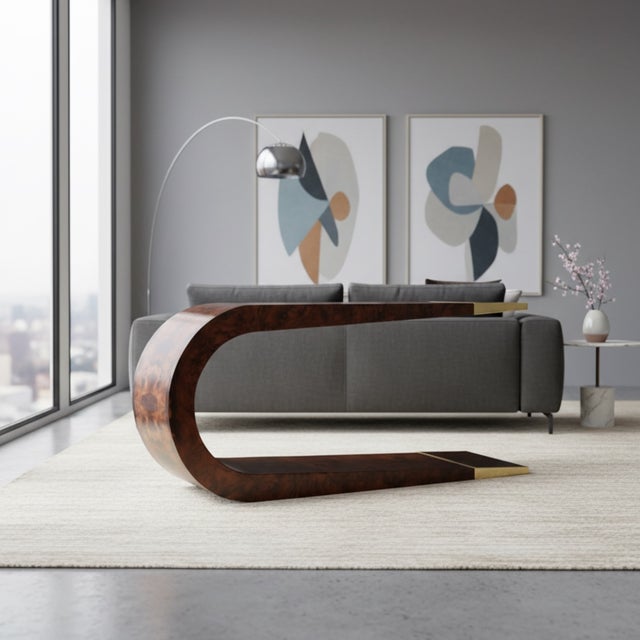 A striking sculptural Aries console by ST2 Furniture, crafted in richly figured walnut burl wood veneer and finished with...