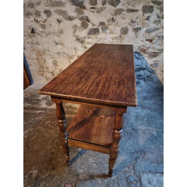 Antique French console or serving table, also suitable for use as a kitchen island, originating from France and dating...