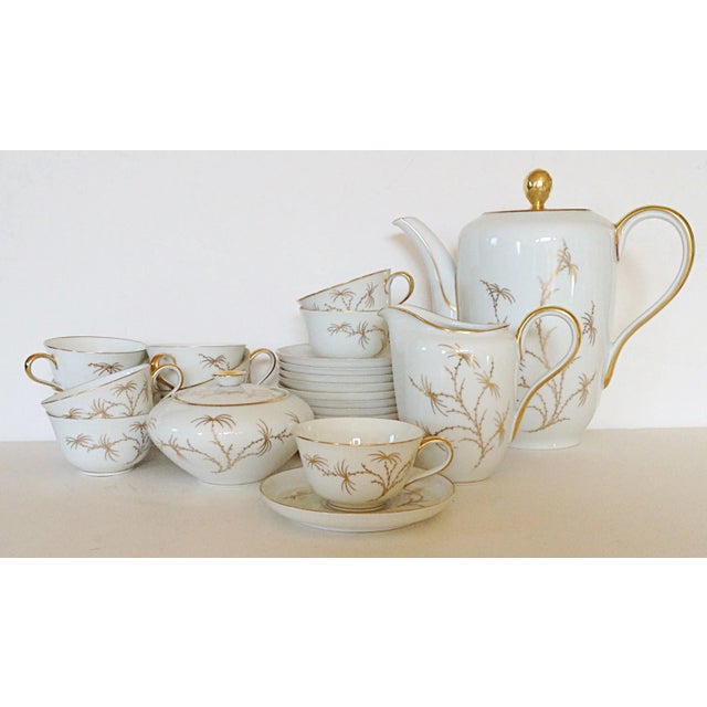 A Rosenthal coffee set to serve eight. The Golden Palm includes a coffee pot with lid, creamer, sugar with lid, 8 saucers...