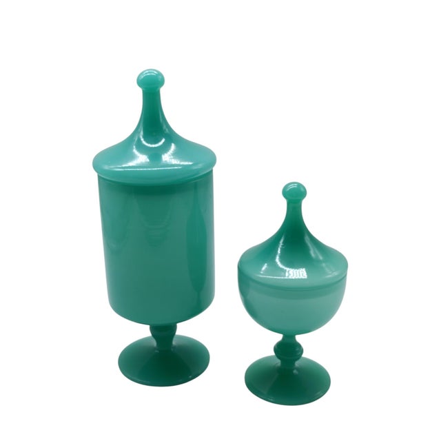 Handcrafted in a charming shade of emerald green, this set comprises two matching vases of different heights: a tall,...