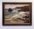 The painting captures a dynamic coastal scene, where tumultuous waves crash against rugged rocks under a moody sky. The...