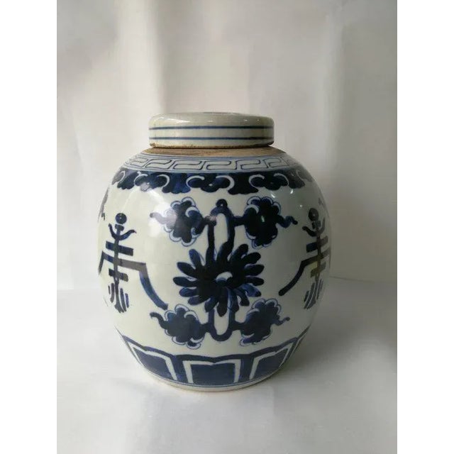 A beautiful blue and white finished porcelain ginger jar with the hand painted symbol and flowers This lidded jar is not...