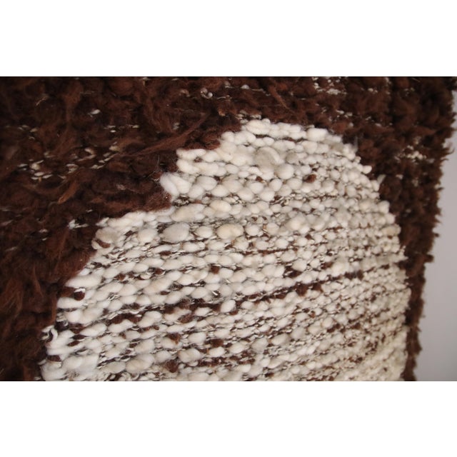 Atmospheric handmade tapestry from the 1970s, executed in rich earth tones. Crafted from various textures of wool, the...