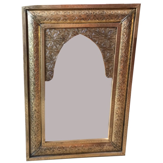 This vintage brass mirror is a true masterpiece of craftsmanship and design. The mirror is designed with an old Spanish...