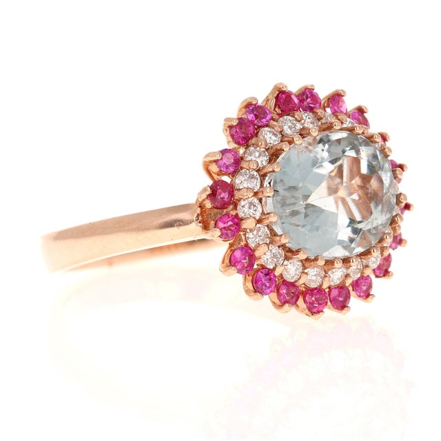 This Ring has a pretty light blue Oval Cut Tourmaline as its center stone that weighs 2.82 carats. The Tourmaline is...