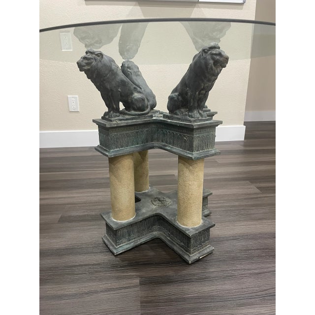 A striking and substantial four-lion table base crafted in the neoclassical tradition. Modeled after early 20th-century...