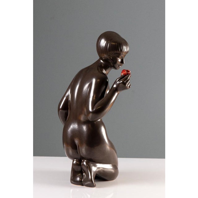 This figurative ceramic sculpture was designed by J. Forejtová for the Kravsko ceramics manufactory. It represents...