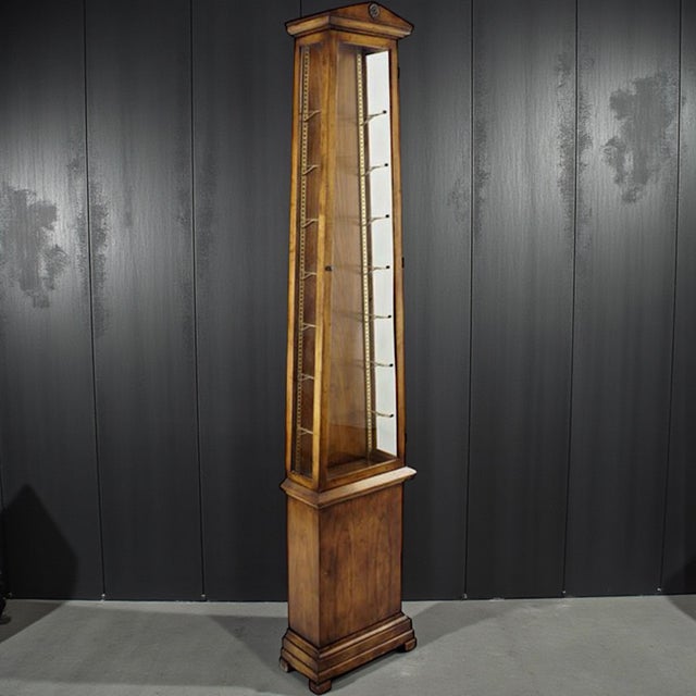 This is a neoclassical style carved fruitwood vitrine by Beacon Hill. It is a numbered limited production piece. The...