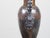 A pair of English tôle amphorae table lamps from the 19th century, with scrolling handles and lucite bases. Created in...