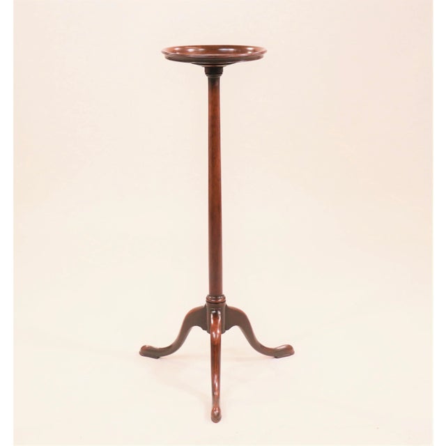 This classic mahogany candlestick table has a nice warm patina with cabriole legs stemming from a tripod base terminating...