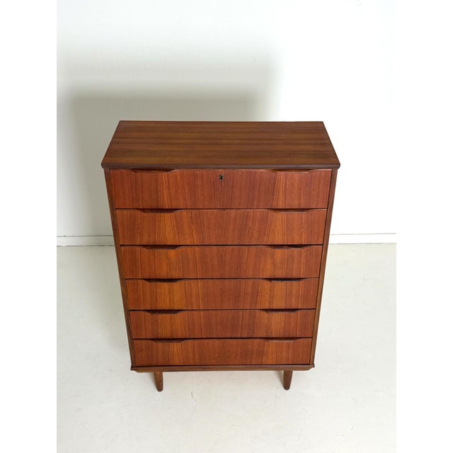 Danish Tallboy Teak Chest, 1960s A timeless Danish tallboy chest from the 1960s, combining clean design with excellent...