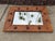 A handsome vintage wall mirror by Bassett Mirror Company featuring a woven rattan surround framed in burnt bamboo and...