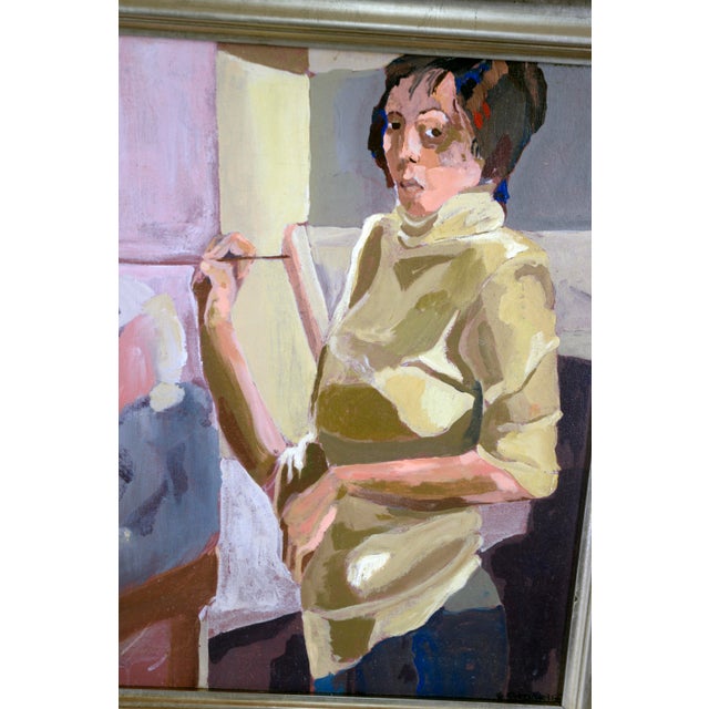 "ULANDA - Painting in Studio Class" Figurative Study Oil on Canvas A dark-haired woman is standing at an easel "Ulanda" a...