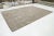 Transform your space with this beautiful contemporary Moroccan-style hand-knotted wool rug. Its captivating beige and...