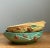 Showcasing the historic legacy of American art pottery, this pair of vintage Roseville pottery bowls from the iconic...