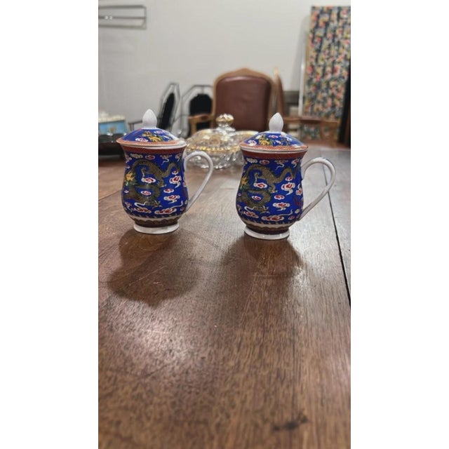 Add classic traditional style to your tea collection or display case with this matching pair of vintage Chinese porcelain...