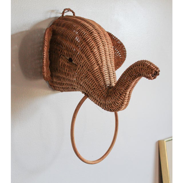 Vintage wicker elephant head towel or scarf holder. No makers mark. Minor age wear. Please note, it does have a attic or...