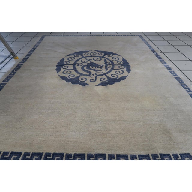 Introducing our exquisite Handmade Vintage Tibetan Khaden Rug from Nepal, showcasing a captivating dragon design at its...