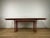 Table with a painted metal base and a granite and glass top, in a postmodern style, made in Italy in the 1970s. The table...