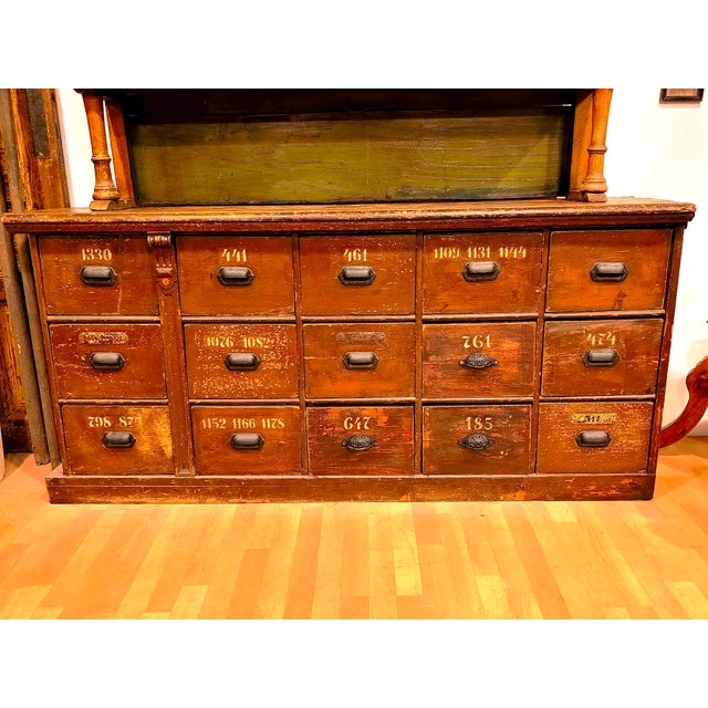 This piece of furniture may have once been in a large store, because it is only part of the original furniture. It is cut...