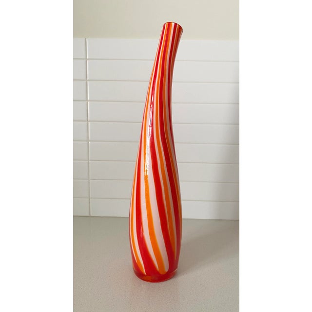 Classic Murano cased glass bottle executed with a 60's candy color scheme using orange and red glass set off so well by...