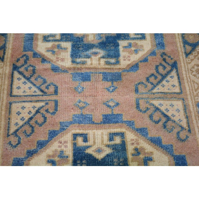 Hand-knotted with care using traditional rug-making techniques, this wool rug blends timeless craftsmanship with a modern...