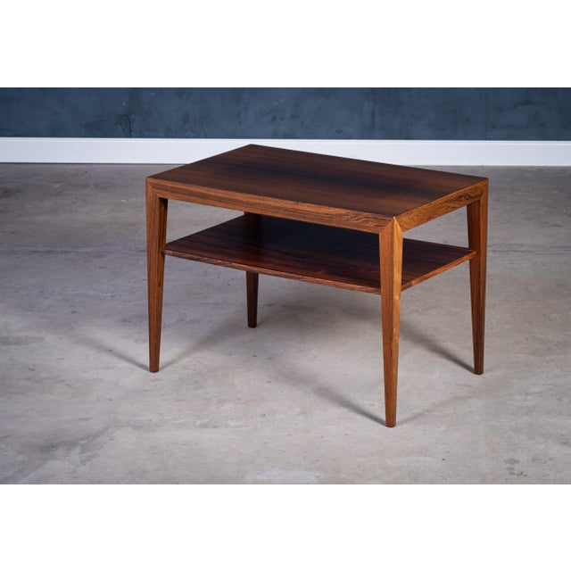 Refined rosewood side table designed by Severin Hansen and produced by Haslev Møbelfabrik in the 1950s. This piece...
