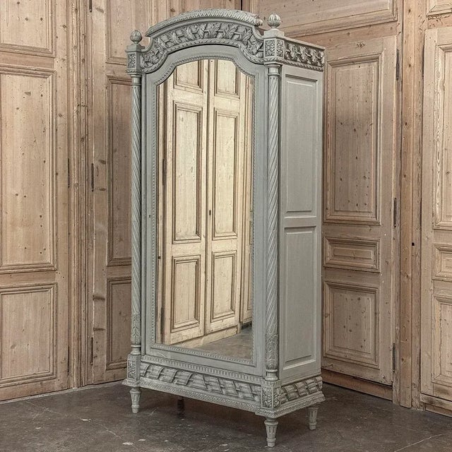 19th Century French Louis XVI Painted Armoire excels at stately elegance but with a lighter color palette that is so...