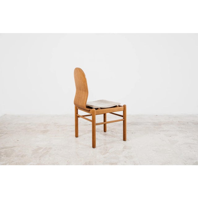 Iconic and sophisticated set of 4 vintage dining chairs, produced by JYSK in the 1970s. A splendid example of mid-century...