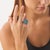 This bold vintage cocktail ring showcases a dramatic cluster composition of 16 mixed cut blue topaz stones totaling...