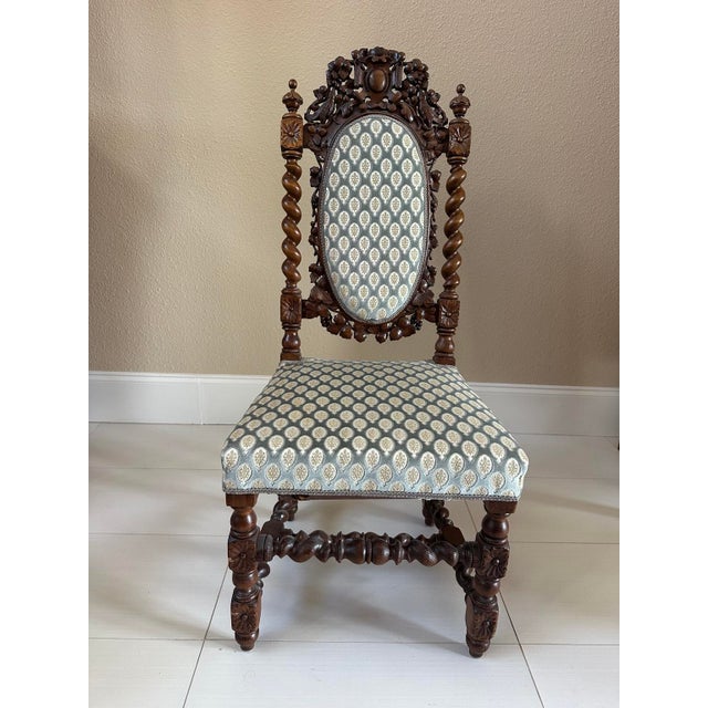 A documented matched set of four French carved oak chairs in the Louis XIII hunting style, circa 1860, accompanied by the...