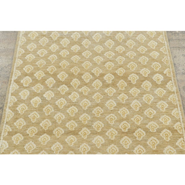 Made with hand-knotted natural silk, this 3x6 runner rug is a sophisticated addition to Rug & Kilim’s Block Print...