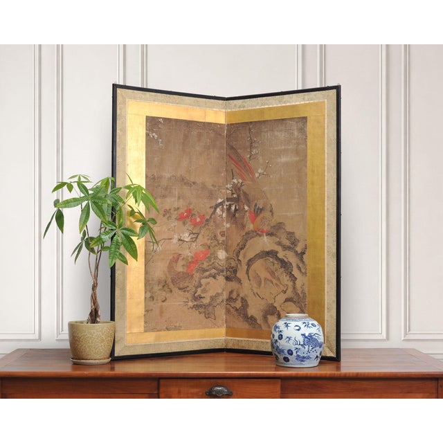 An evocative Japanese Edo period two-panel folding byobu screen depicting a pair of pheasants in a late winter or early...