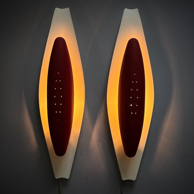 A charming pair of wall lamps, model 8787, produced by the renowned Swedish manufacturer Arvid Böhlmarks Lampfabrik in the...