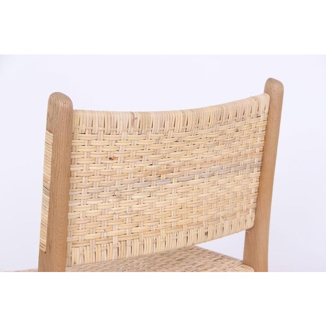 4 Hans J. Wegner chairs, model CH-31, light-colored, soap-treated oak and new Danish hand-woven seat, known as Sene weave....