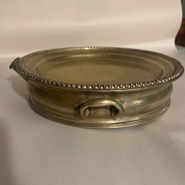 Antique Early Silverplated, probably Sheffield plate, hot plate. Fill the interior well with hot water and place food or a...