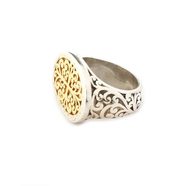This is an authentic signed ring by Lois Hill, it is crafted from sterling silver with yellow gold platting . The top of...