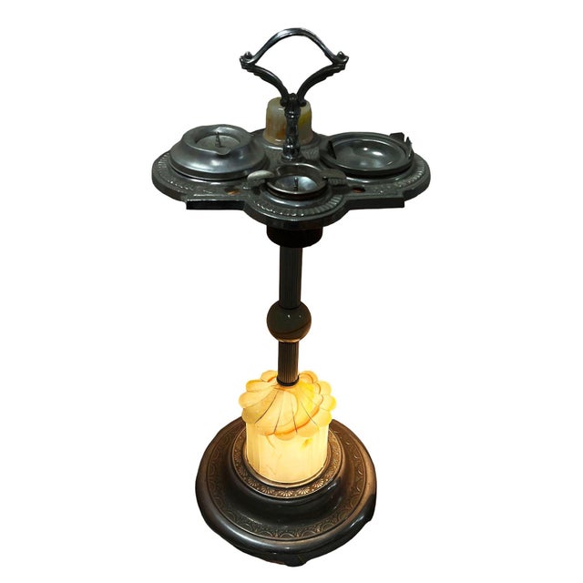 Art Deco chrome Astray Stand featuring a light-up art glass base. This dual-purpose accent lamp and ashtray piece boasts a...