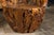 A vintage pair of American root wood armchairs with wraparound backs and rustic character. Experience the raw allure of...