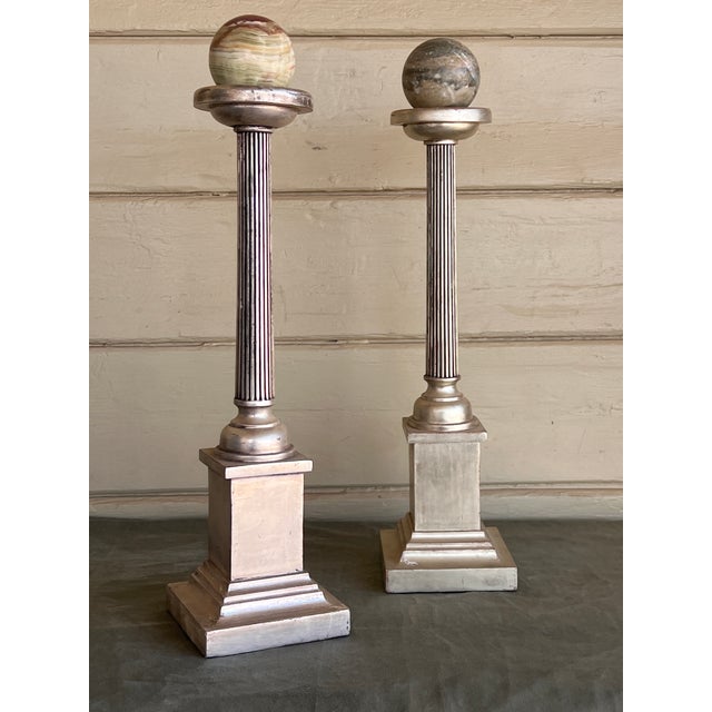 Vintage elegant pair of classical pillar stands, featuring a sophisticated antique silver gilded wood column oillars with...