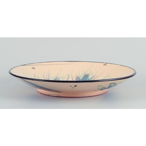 Heidi Fournier for Kähler, Denmark. Large ceramic bowl. Floral motifs on a cream-coloured base. Approximately from the...