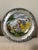 Pewter and porcelain plates depicting the four seasons of spring, summer, fall, and winter. They have a hook on the back...