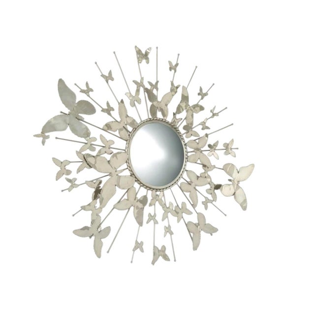 Sculptural butterfly wall mirror by Global Views, crafted in nickel-plated brass with a dynamic arrangement of delicately...