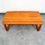 Solid teak coffee table by KB Furniture. Dovetailed teak sled style legs. Unique style and design.