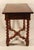 Unique table with exquisite marquetry in cherrywood, kingwood, walnut and elm. The marquetry depicts presentations of...