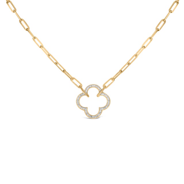 Light dances across this luminous talisman, where a sleek paperclip chain of elongated ovals drapes like liquid sunlight...