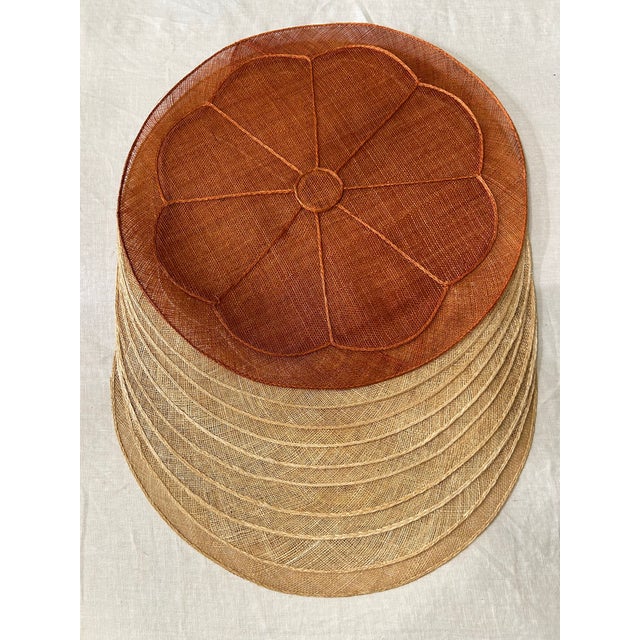 A set of 10 woven abaca fiber placemats, made in the Philippines exclusively for Neiman Marcus. The sculptural floral...