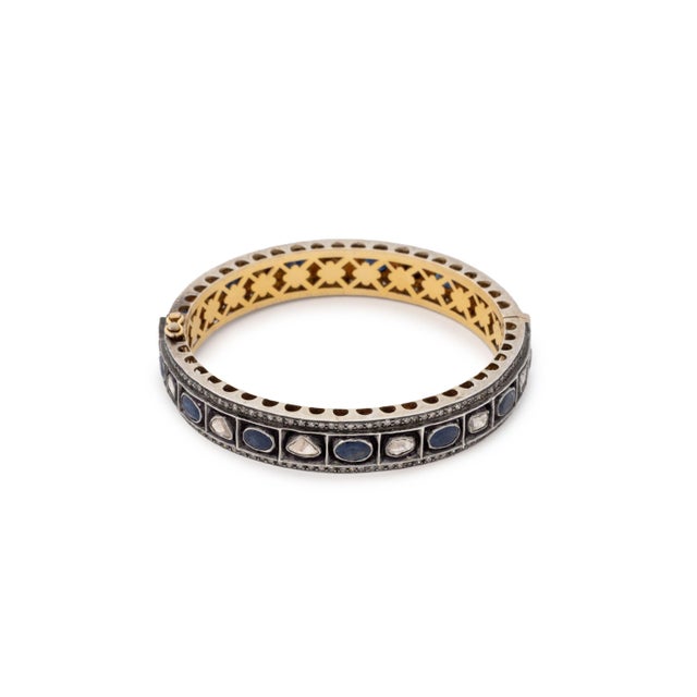 14K Yellow Gold Sterling Silver Diamond Sapphire Bangle, hand fabricated design forming its base as 14K yellow gold inside...