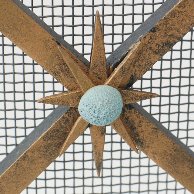 The Celeste Fireplace Screen's hand-forged star points and colorful, textural ceramic spheres evoke the beauty of a clear...