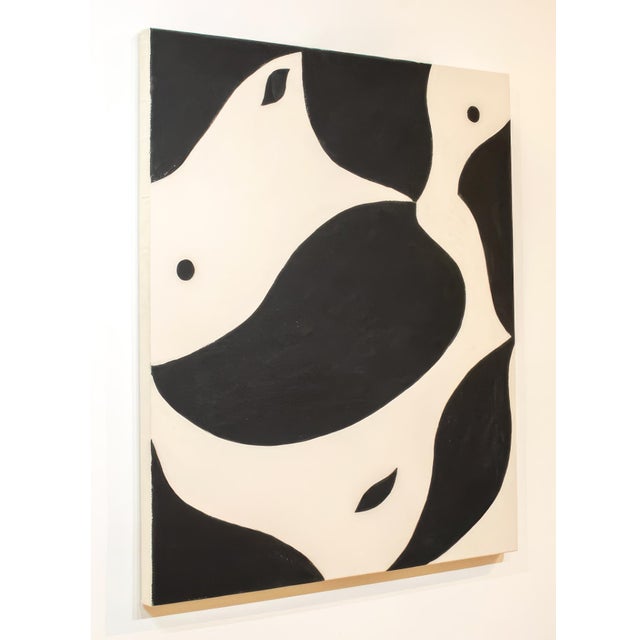 "Silent Embrace" features flowing black and ivory forms that curve around one another, creating a sense of movement and...